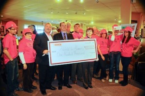 Executives from The Brick Ltd. presented a $100,000 cheque to Habitat for Humanity Huron County for its 2013 build in Goderich.