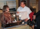 Huron County Museum curator Patricia Hamilton shows artifacts recovered from The Great Storm 1913 to Global News Toronto reporter Mark McAllister and cameraman Ben Jonah.