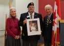 Richard Robarts and his wife, Donalda, of Goderich and Windsor, present Paul Thorne, who is president of Royal Canadian Legion Branch 109, with a lithograph portrait of Queen Elizabeth II on the occasion of Her Majesty's Diamond Jubilee. Richard was a recent recipient of the Queen' s Diamond Jubilee Medal and was given the print to mark the occasion.