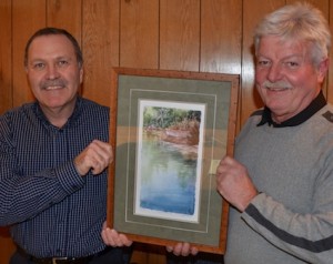 Bruce Hodge, president of the Exeter Lions Club, and Bob Laye, chair of the Conservation Dinner Committee, hold the limited-edition print Midday Pause, by artist Elisabeth Tonner-Keats.