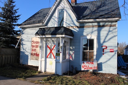 A sign was posted in front of the home during Windstock, the one-year celebration after the tornado. The Brindley family has been homeless for more than 16 months now.