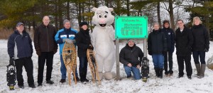 Shown at the entrance to the MacNaughton-Morrison Section of the South Huron Trail, are some of the organizers and supporters, along with Exeter’s White Squirrel, getting ready for Family Day WinterFest South Huron. (left to right): Tim Cumming, Ausable Bayfield Conservation; Tim Sweet, Exeter Curling Club; Lorne Rideout, Friends of the South Huron Trail; Judy McLeod, Exeter Lioness Club; George Finch, organizer; Jean Jacobe, Trivitt Memorial Anglican Church; Jo-Anne Fields, Manager of Community Services, Municipality of South Huron; Darcey Cook, Municipality of South Huron Recreation Department Program and Events Assistant; and Maggie Miller, Big Brothers and Big Sisters of South Huron.