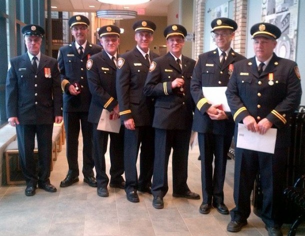 Six officers from the Goderich Fire Department and newly retired firefighter Dale Baechler were presented Queen Elizabeth II Diamond Jubilee Medals at Goderich Town Council for their contribution to the August 2011 tornado emergency response. From left: Baechler, Chief Steve Gardiner, Capt. John Dobie, Capt. Darren Doak, Capt. Jeff Wormington, Deputy Chief Keith Crittenden, and Capt. Wes Gozzard. Baechler also received his 30-year bar. Photo courtesy of Melissa Wormington.