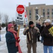 Anti-wind turbine supporters rally outside Goderich's courthouse.