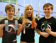 The swimmers show off their top results against a tough field.  From left to right; Natalie 8th in both the 50m backstroke and 50m breast stroke, Sabrina with a 7th in the 50m freestyle and on the podium with a 3rd place bronze medal in the 50m butterfly, and Paul with a 5th in the 50m breaststroke.